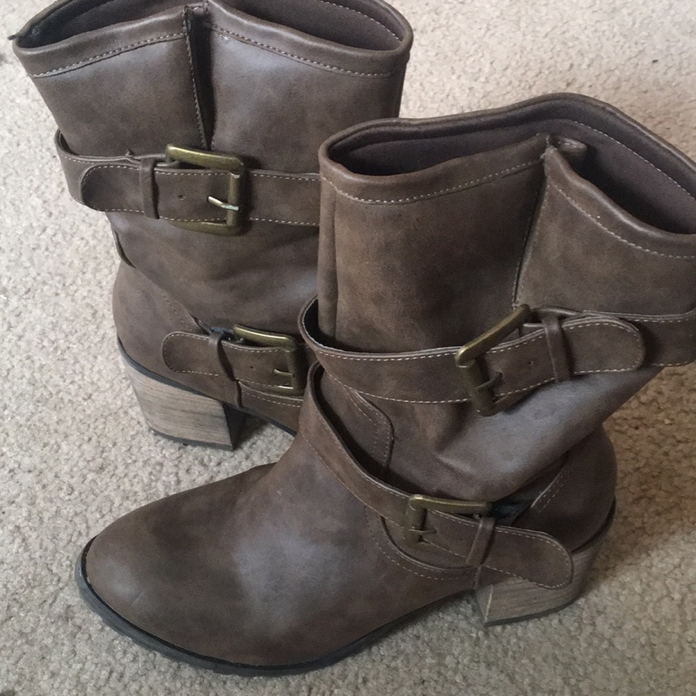 Brown buckle boots with a heel